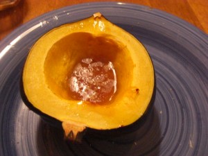 Baked acorn squash with butter and maple syrup
